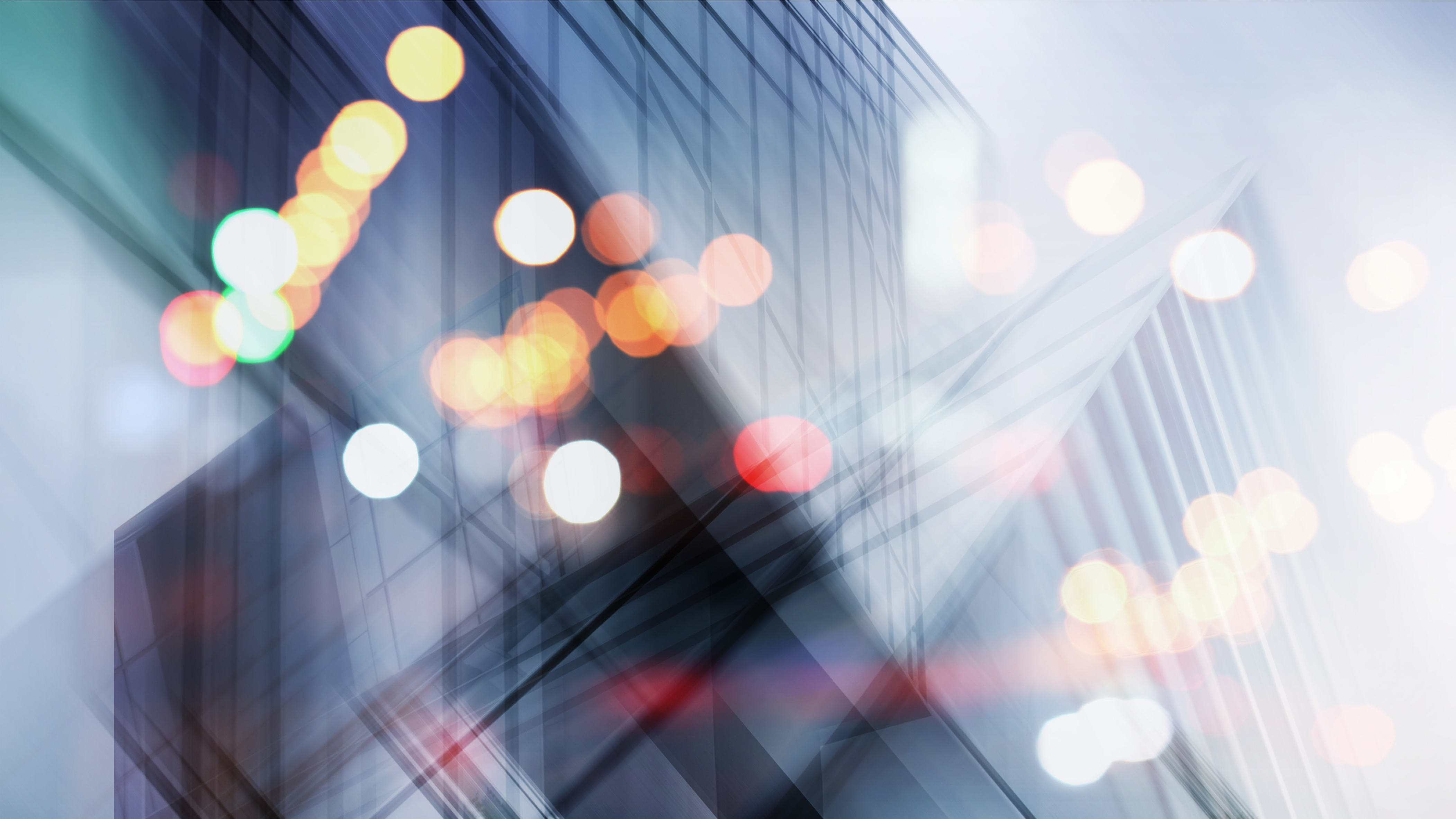 Abstract business modern city urban futuristic architecture background. Real estate concept, motion blur, reflection in glass of high rise skyscraper facade, toned blue picture with bokeh.