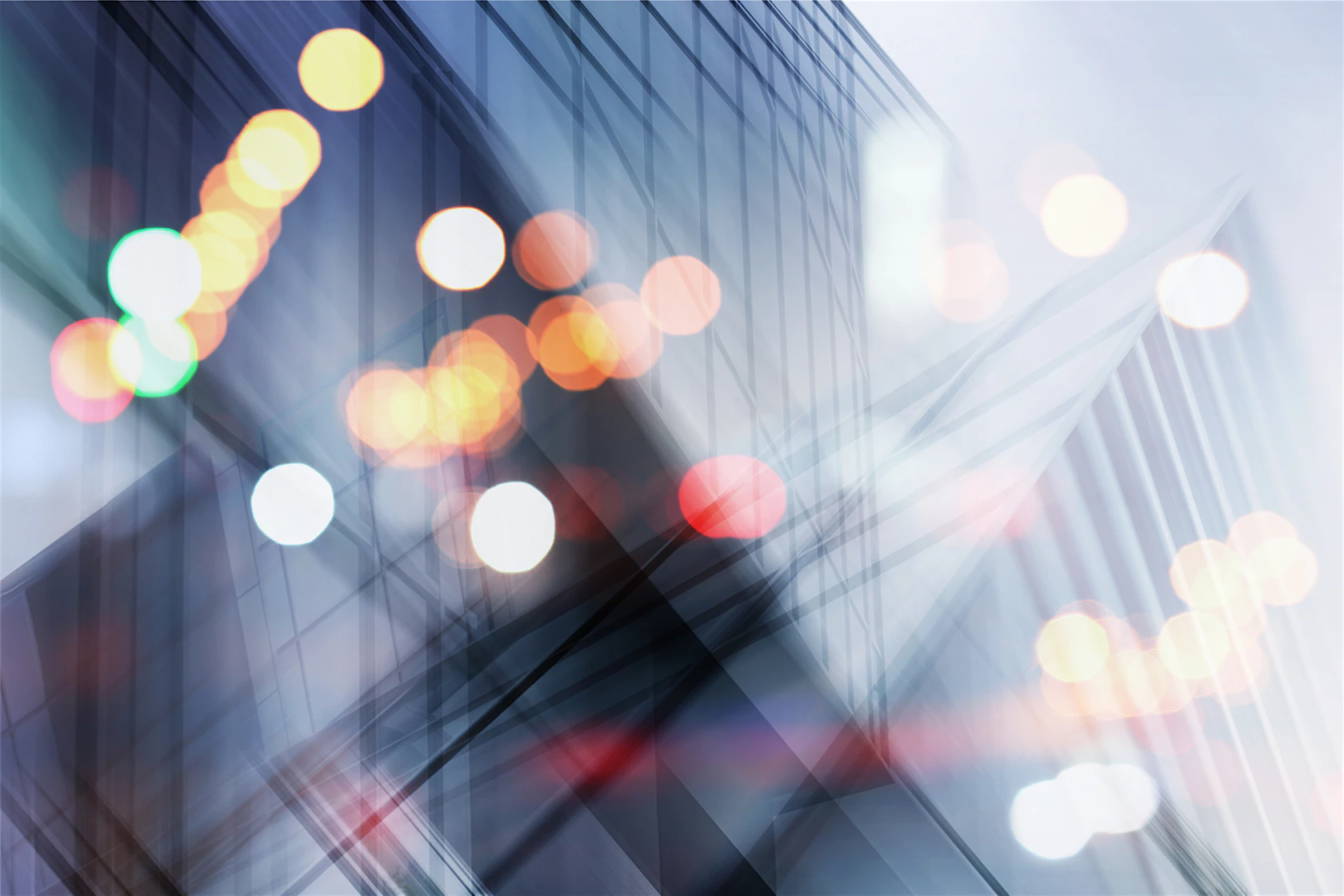 Abstract business modern city urban futuristic architecture background. Real estate concept, motion blur, reflection in glass of high rise skyscraper facade, toned blue picture with bokeh.