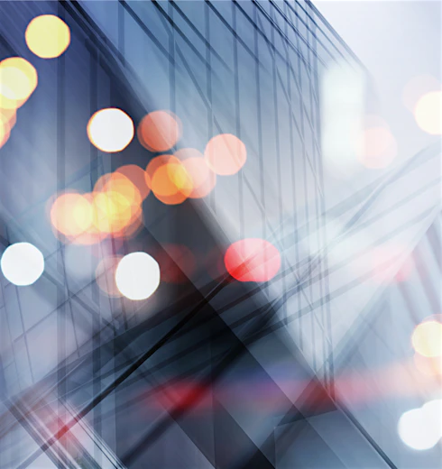 Abstract business modern city urban futuristic architecture background. Real estate concept, motion blur, reflection in glass of high rise skyscraper facade, toned blue picture with bokeh.
