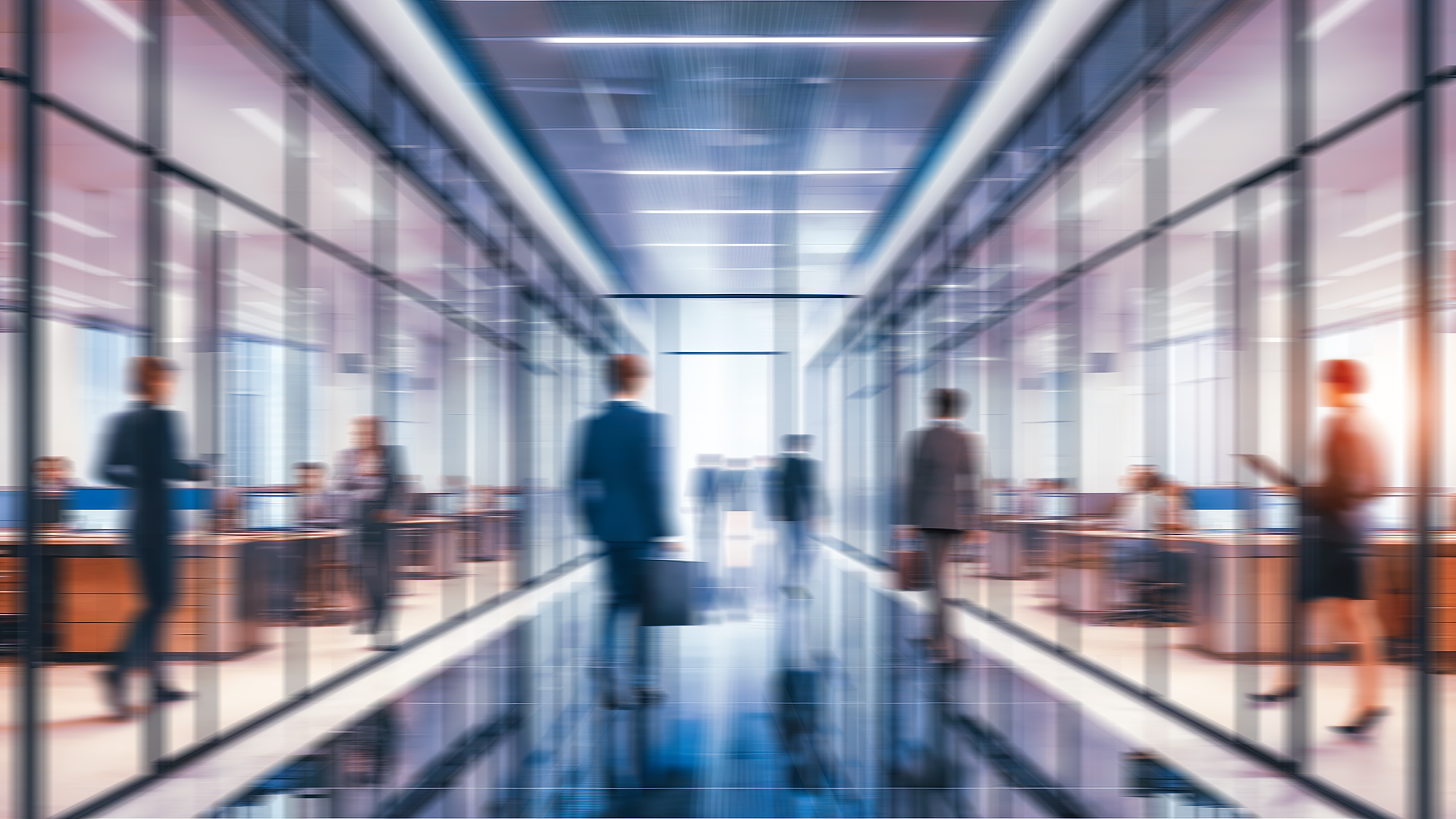 Business people walking in office, blurry working space with defocused effect, blurred motion business background